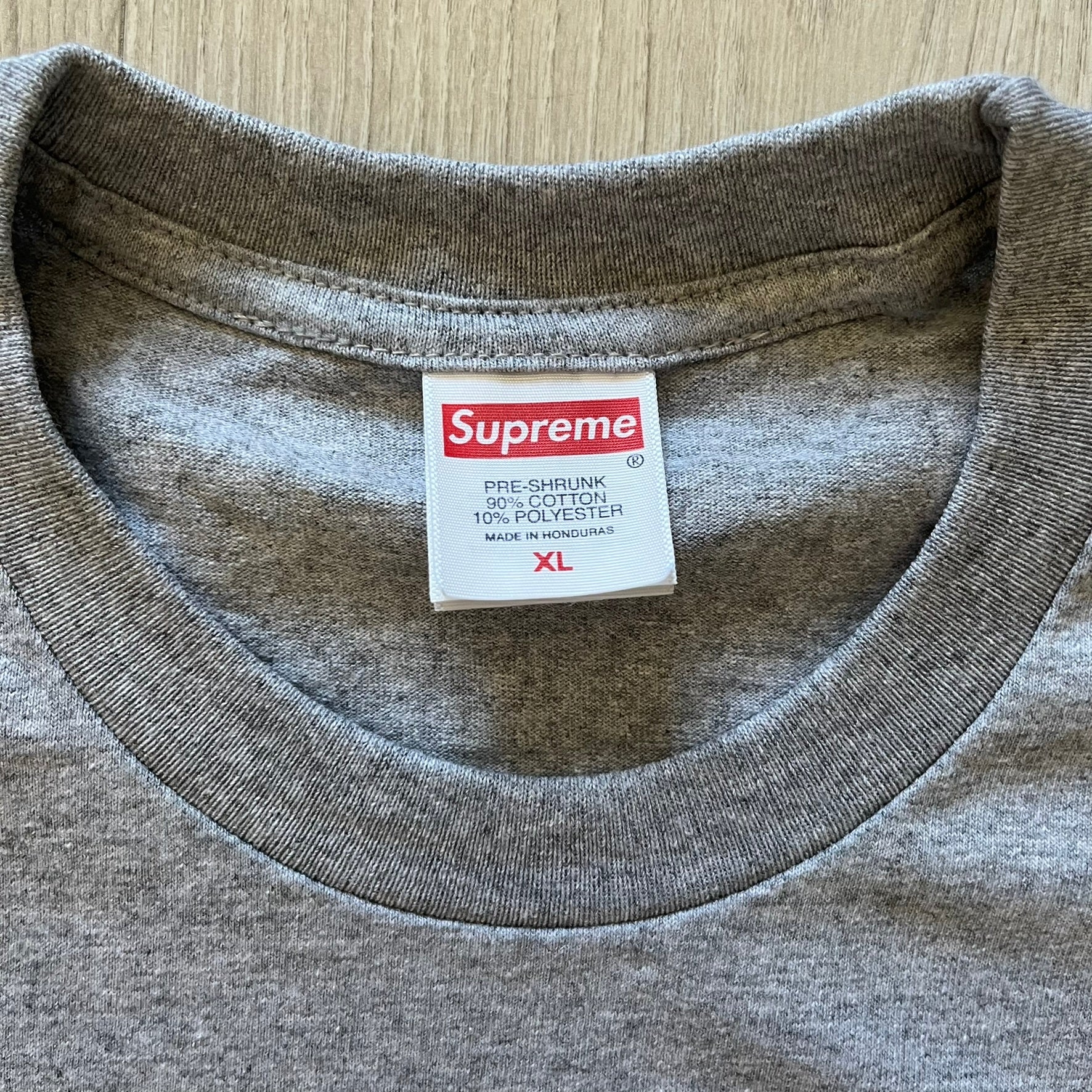 Supreme Playboi Carti photo tee in Heather Gray from the FW25 collection, featuring a large front print of the influential rapper. Crafted from soft cotton, it merges Supreme’s iconic photo tee format with Carti’s distinct cultural presence.