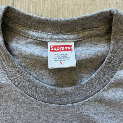 Supreme Playboi Carti photo tee in Heather Gray from the FW25 collection, featuring a large front print of the influential rapper. Crafted from soft cotton, it merges Supreme’s iconic photo tee format with Carti’s distinct cultural presence.