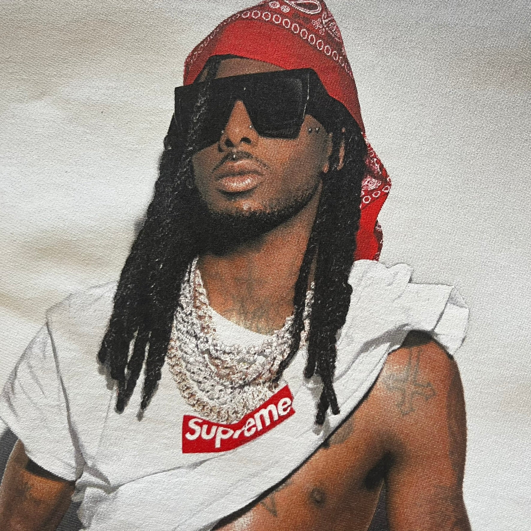 Supreme Playboi Carti photo tee in white from the FW25 collection, featuring a large front print of the influential rapper. Crafted from soft cotton, it merges Supreme’s iconic photo tee format with Carti’s distinct cultural presence.
