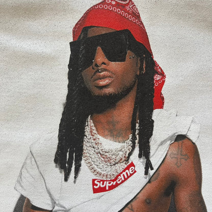  Supreme Playboi Carti photo tee in Woodland Camo from the FW25 collection, featuring a large front print of the influential rapper. Crafted from soft cotton, it merges Supreme’s iconic photo tee format with Carti’s distinct cultural presence.