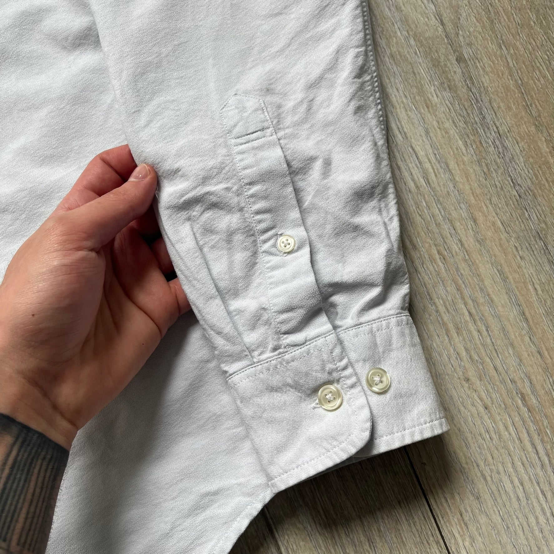 Supreme SS19 Oxford Shirt is a light blue button-up shirt from the Spring/Summer 2019 collection, released on February 21, 2019. It features a button-front closure, a standard collar, and a single chest pocket with a small Supreme tag attached to the side.