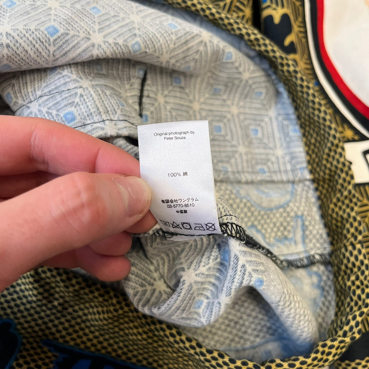 Supreme SS2017 Obama Green Anorak is a green/olive 100% cotton quarter-zip anorak with an all-over patchwork print incorporating Barack Obama’s face, the words “Barack Obama,” and scattered Supreme logos. The design pays homage to the “khanas,” vibrant patterned garments with political graphics made by local designers in Ghana to commemorate the former president’s 2009 visit. It has a drawstring hood and hem and lower front hand pockets.