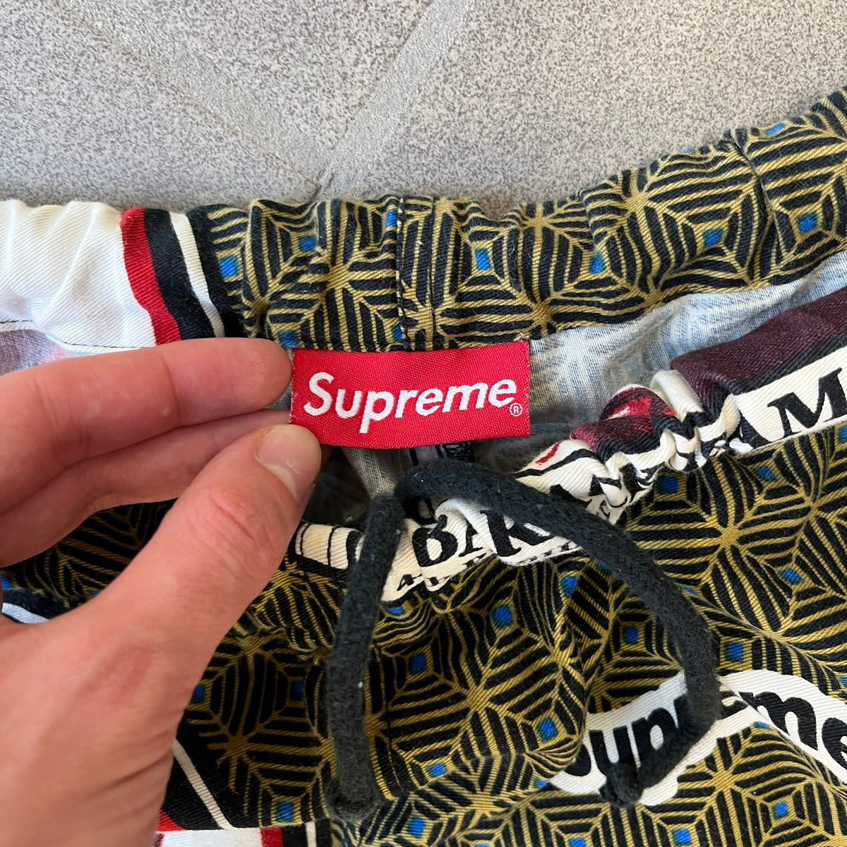 Supreme SS2017 Obama Green Pants are green/olive pants with the all-over patchwork print incorporating Barack Obama’s face, the words “Barack Obama,” and scattered Supreme logos. The design pays homage to the “khanas,” vibrant patterned garments with political graphics made by local designers in Ghana to commemorate the former president’s 2009 visit. They have two front pockets and one back pocket.