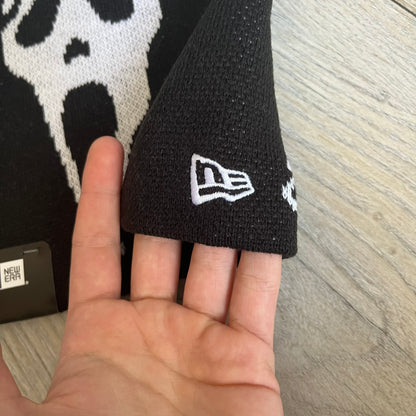 Supreme SS26 New Era Ghostface Black Beanie is a black knit beanie released on March 26, 2026, as part of the Spring/Summer 2026 collection. The front features a white Ghostface graphic, while the back includes “Supreme” text in a gothic-style font, with a small New Era logo embroidered on the side. The beanie is constructed from knit fabric for warmth and everyday wear.