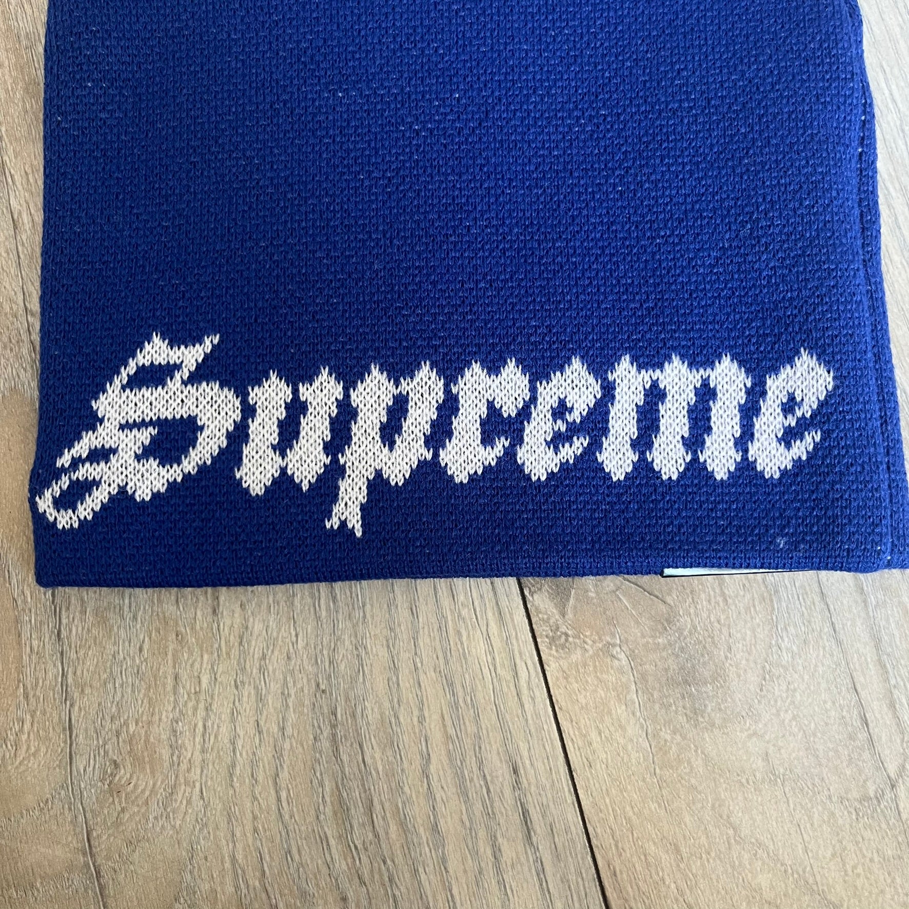 Supreme SS26 New Era Ghostface Black Beanie is a Royal (Blue) knit beanie released on March 26, 2026, as part of the Spring/Summer 2026 collection. The front features a white and black Ghostface graphic, while the back includes “Supreme” text in a gothic-style font, with a small New Era logo embroidered on the side. The beanie is constructed from knit fabric for warmth and everyday wear.