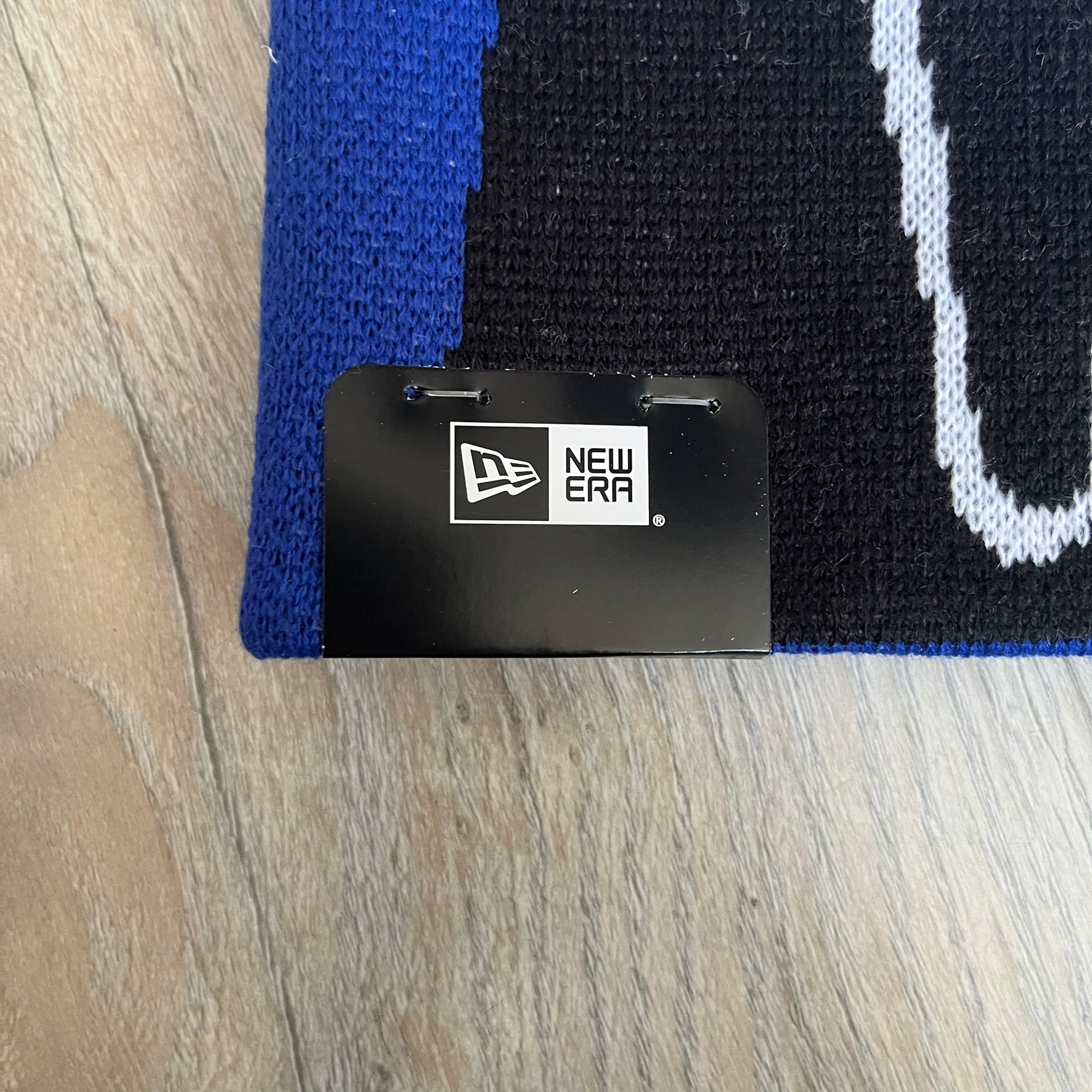 Supreme SS26 New Era Ghostface Black Beanie is a Royal (Blue) knit beanie released on March 26, 2026, as part of the Spring/Summer 2026 collection. The front features a white and black Ghostface graphic, while the back includes “Supreme” text in a gothic-style font, with a small New Era logo embroidered on the side. The beanie is constructed from knit fabric for warmth and everyday wear.