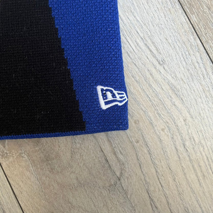 Supreme SS26 New Era Ghostface Black Beanie is a Royal (Blue) knit beanie released on March 26, 2026, as part of the Spring/Summer 2026 collection. The front features a white and black Ghostface graphic, while the back includes “Supreme” text in a gothic-style font, with a small New Era logo embroidered on the side. The beanie is constructed from knit fabric for warmth and everyday wear.