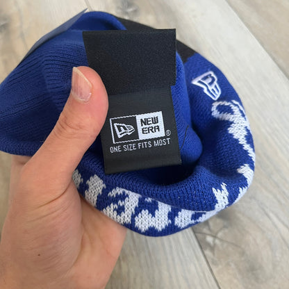 Supreme SS26 New Era Ghostface Black Beanie is a Royal (Blue) knit beanie released on March 26, 2026, as part of the Spring/Summer 2026 collection. The front features a white and black Ghostface graphic, while the back includes “Supreme” text in a gothic-style font, with a small New Era logo embroidered on the side. The beanie is constructed from knit fabric for warmth and everyday wear.