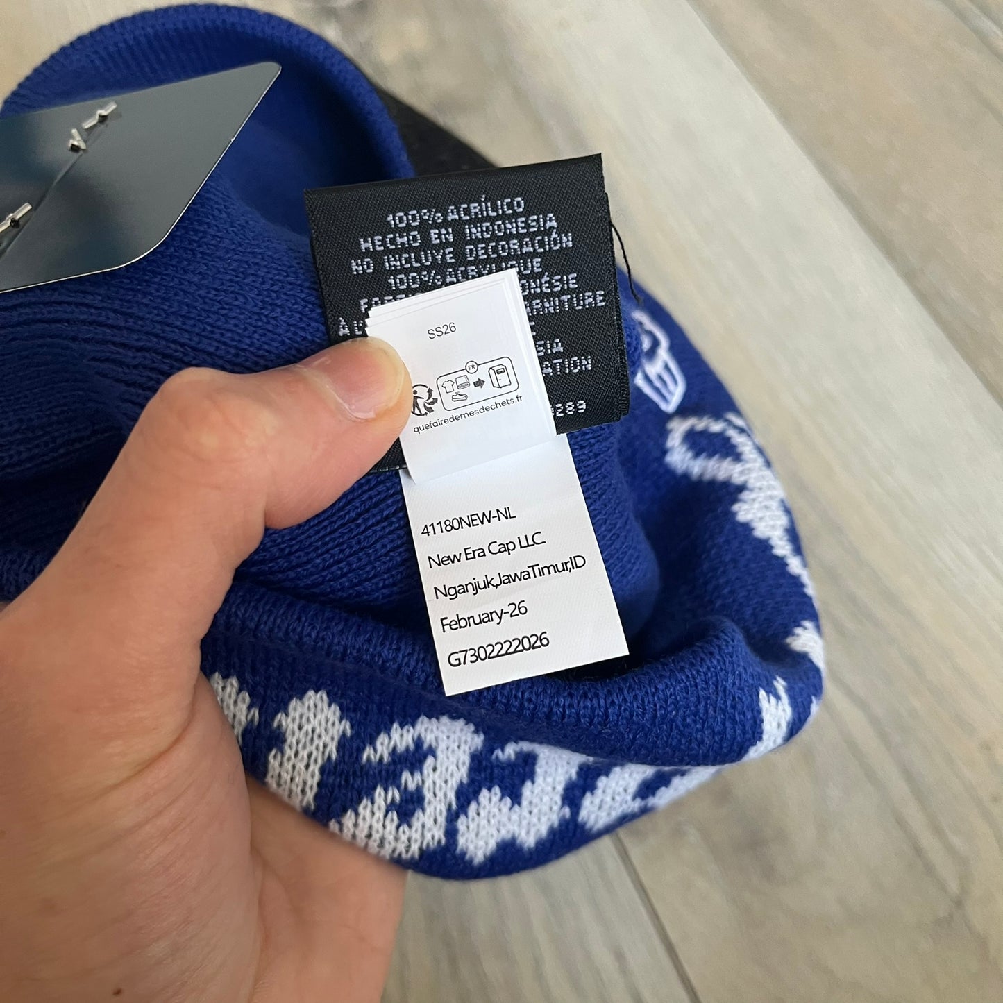 Supreme SS26 New Era Ghostface Black Beanie is a Royal (Blue) knit beanie released on March 26, 2026, as part of the Spring/Summer 2026 collection. The front features a white and black Ghostface graphic, while the back includes “Supreme” text in a gothic-style font, with a small New Era logo embroidered on the side. The beanie is constructed from knit fabric for warmth and everyday wear.