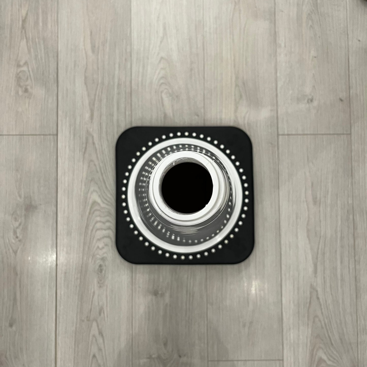 The Supreme Traffic Cone FW25 White features a clean white PVC body with a classic red Supreme box logo on the lower front. Designed for display purposes only, it sits on a black base and is not intended for use as a functional traffic marker. Released on October 16, 2025.