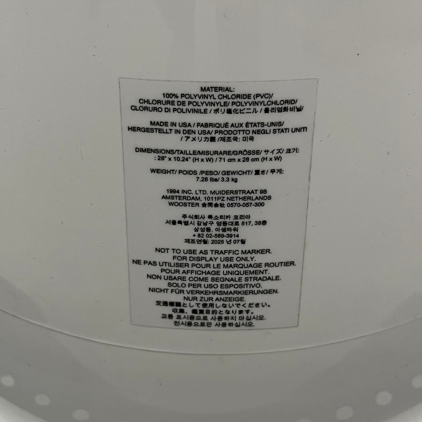 The Supreme Traffic Cone FW25 White features a clean white PVC body with a classic red Supreme box logo on the lower front. Designed for display purposes only, it sits on a black base and is not intended for use as a functional traffic marker. Released on October 16, 2025.