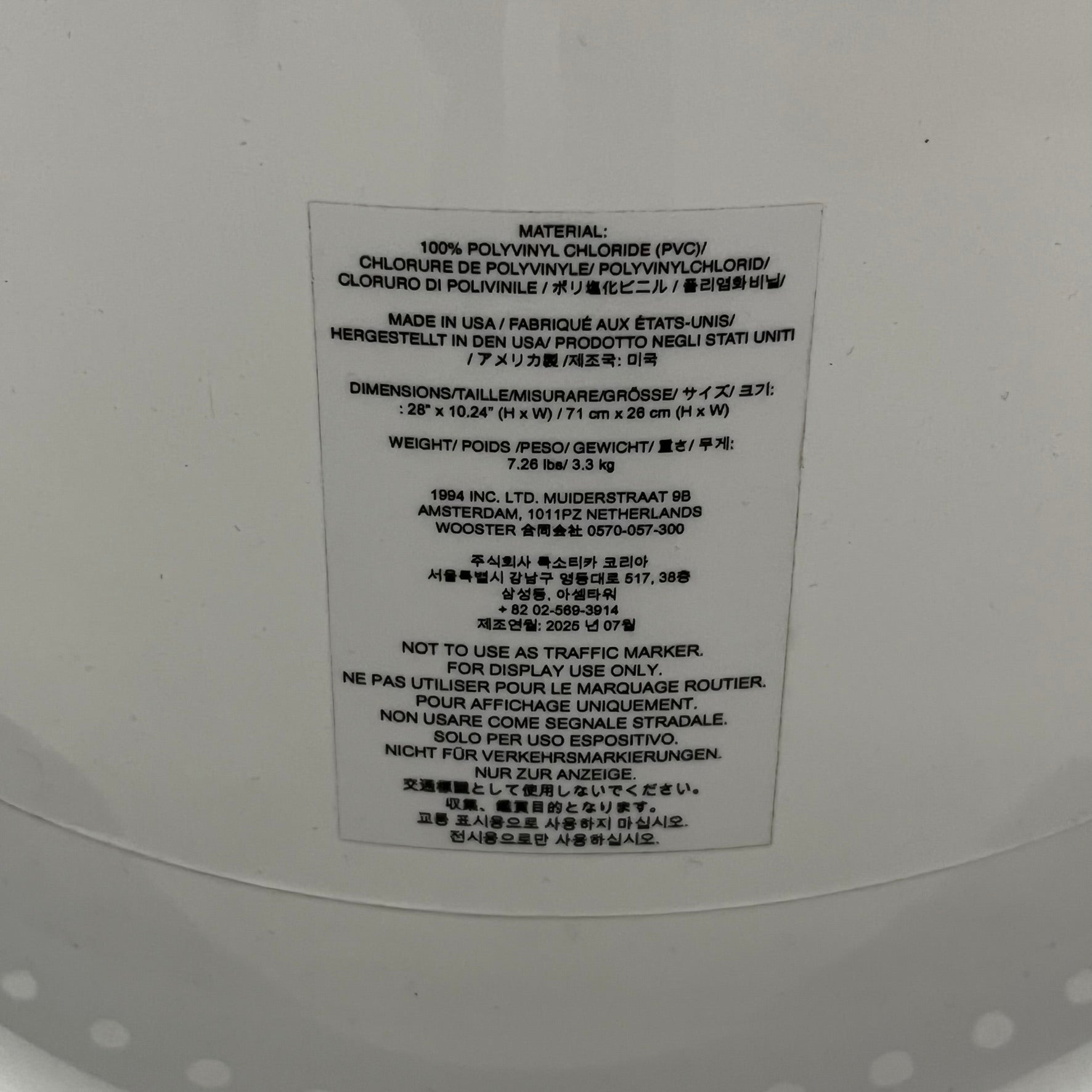 The Supreme Traffic Cone FW25 White features a clean white PVC body with a classic red Supreme box logo on the lower front. Designed for display purposes only, it sits on a black base and is not intended for use as a functional traffic marker. Released on October 16, 2025.
