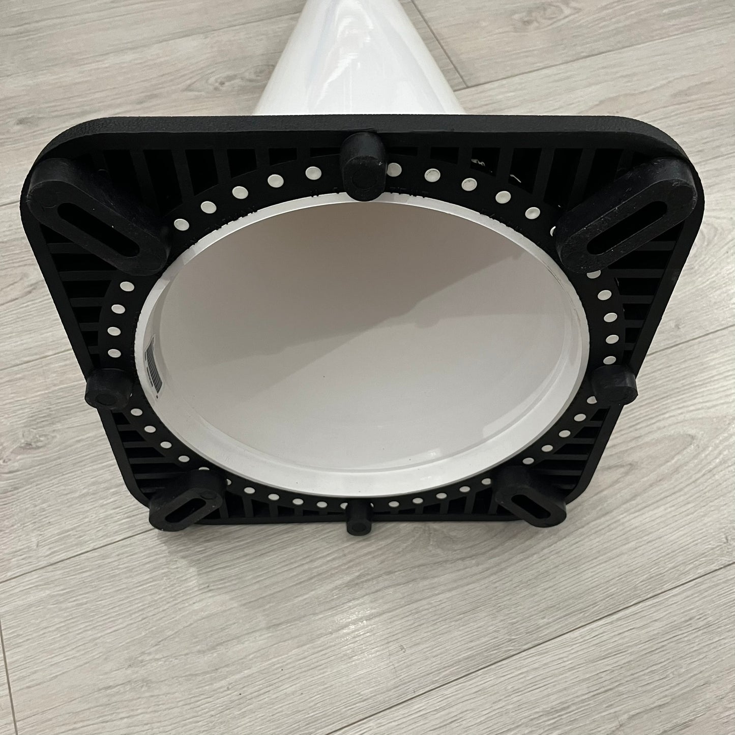 The Supreme Traffic Cone FW25 White features a clean white PVC body with a classic red Supreme box logo on the lower front. Designed for display purposes only, it sits on a black base and is not intended for use as a functional traffic marker. Released on October 16, 2025.