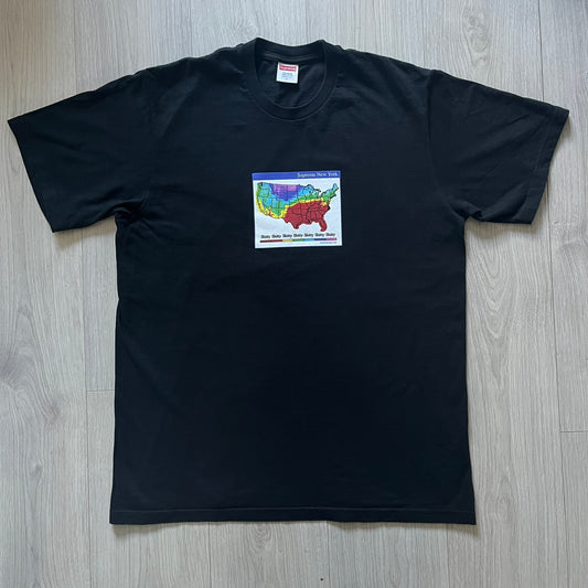 Supreme “Weather” FW23 tee in black, showcasing a satirical weather map graphic of the USA. Below sits a gradient bar in red-to-pink tones, with every category marked “Shitty.” Includes small Supreme New York text detail, true to the collection.