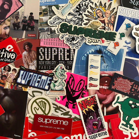 A collection of various stickers including brand logos and abstract designs.