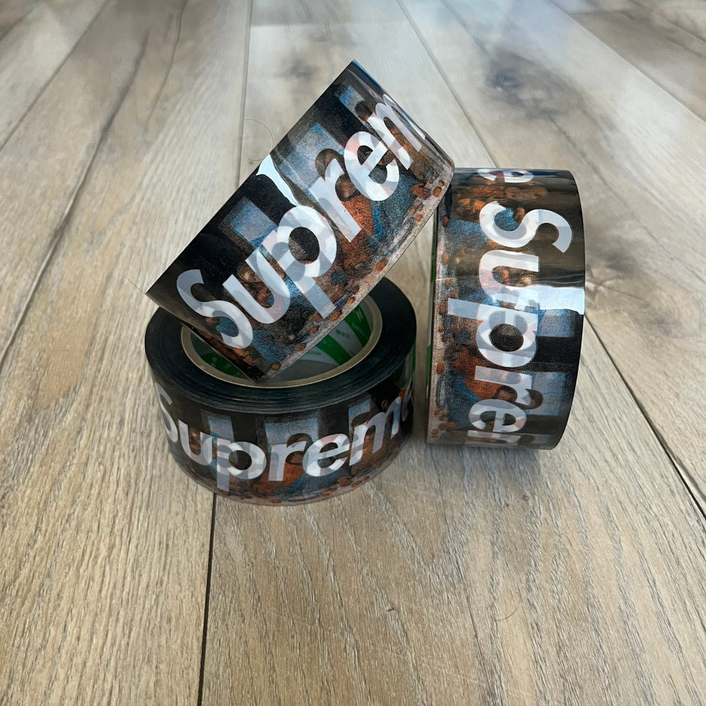Supreme x Nichiban Packing Tape Multicolor is a single roll of durable packing tape released as part of the Spring/Summer 2026 collection on May 21, 2026. Made in Japan exclusively for Supreme, the tape features a multicolor background with repeating white Supreme box logo prints across the surface. Designed as both a functional accessory and collectible branded item.
