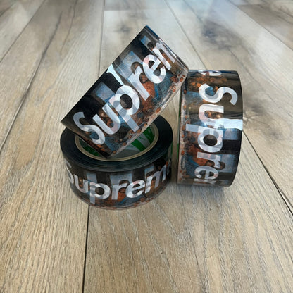 Supreme x Nichiban Packing Tape Multicolor is a single roll of durable packing tape released as part of the Spring/Summer 2026 collection on May 21, 2026. Made in Japan exclusively for Supreme, the tape features a multicolor background with repeating white Supreme box logo prints across the surface. Designed as both a functional accessory and collectible branded item.