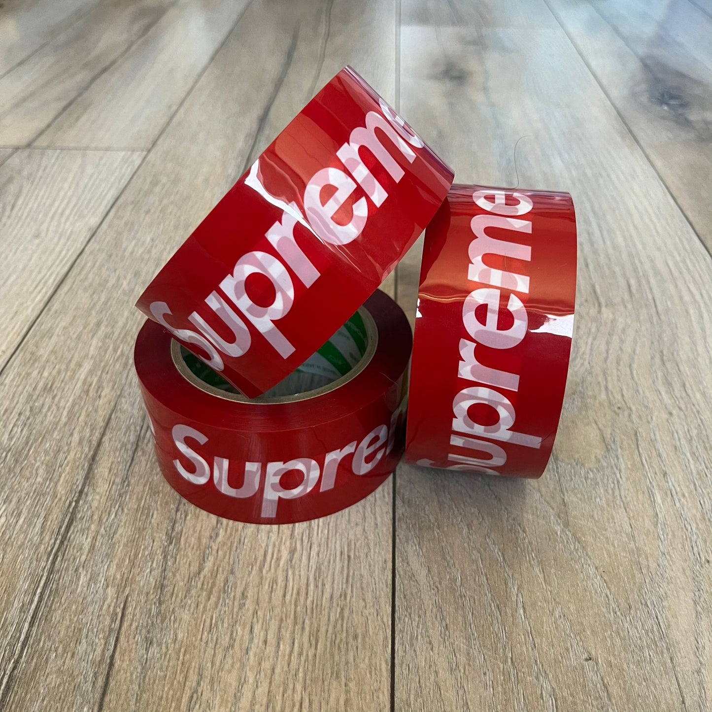 Supreme x Nichiban Packing Tape Red is a single roll of durable packing tape released as part of the Spring/Summer 2026 collection on May 21, 2026. Made in Japan exclusively for Supreme, the tape features an all-over red design with repeating white Supreme box logo prints. The roll is designed for practical use while also functioning as a collectible branded accessory.
