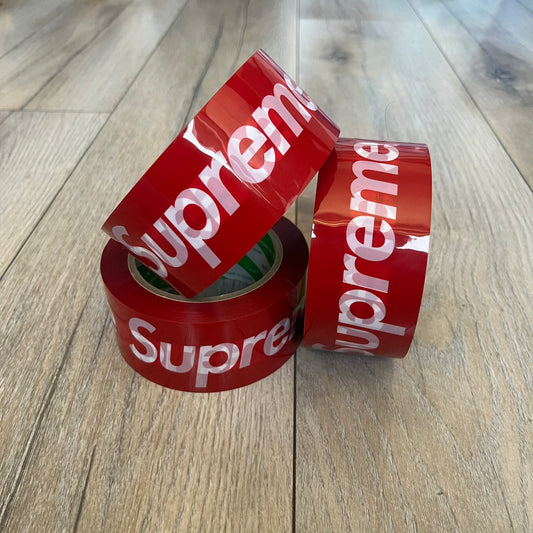 Supreme x Nichiban Packing Tape Red is a single roll of durable packing tape released as part of the Spring/Summer 2026 collection on May 21, 2026. Made in Japan exclusively for Supreme, the tape features an all-over red design with repeating white Supreme box logo prints. The roll is designed for practical use while also functioning as a collectible branded accessory.