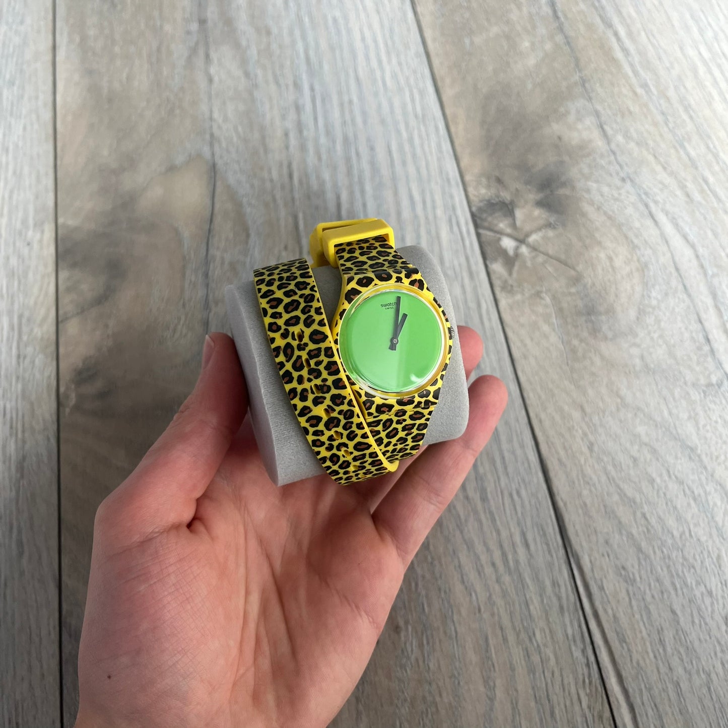 Swatch x Jeremy Scott 2011 Punk Analog Watch GZ251 is a quartz watch from the Gent Original line featuring a bright green dial with black hands and a plastic case. The design includes a comically long silicone strap with leopard print that wraps twice around the wrist, secured with multiple yellow loops, and Jeremy Scott branding on the upper strap. The watch is water resistant to 3 bar and comes with original box and papers