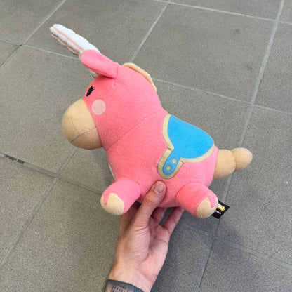 Team Fortress 2 Balloonicorn 2013 Plushie is a pink plush based on the Balloonicorn character from Pyroland, introduced in the 2012 Pyromania update. Released by Valve in 2013 as part of the first series of Valve-themed plush toys, it measures approximately 14.5 inches from horn tip to tail. This plush comes without the original in-game item code.
