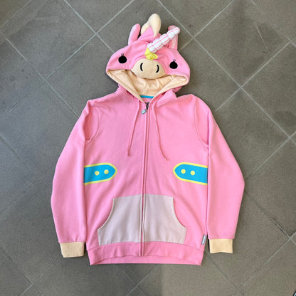 Team Fortress 2 Balloonicorn 2015 WeLoveFine Zip-Up Hoodie is a bright pink unisex colorblock hoodie from Valve’s Team Fortress 2 line, with a detailed 3D plush Balloonicorn hood featuring embroidered eyes, a 3D horn, nose, and ears. It has front pockets, a custom metal Balloonicorn cameo zipper pull, and a light blue printed saddle graphic that wraps from the back to the front. The licensed TF2 neck tag carries 2015 and We Love Fine branding. Super rare.