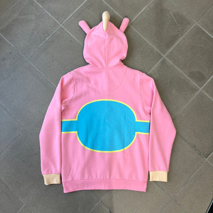 Team Fortress 2 Balloonicorn 2015 WeLoveFine Zip-Up Hoodie is a bright pink unisex colorblock hoodie from Valve’s Team Fortress 2 line, with a detailed 3D plush Balloonicorn hood featuring embroidered eyes, a 3D horn, nose, and ears. It has front pockets, a custom metal Balloonicorn cameo zipper pull, and a light blue printed saddle graphic that wraps from the back to the front. The licensed TF2 neck tag carries 2015 and We Love Fine branding. Super rare.