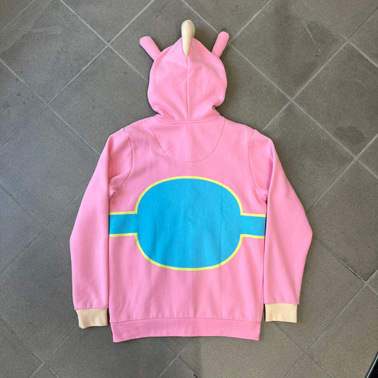 Team Fortress 2 Balloonicorn 2015 WeLoveFine Zip-Up Hoodie is a bright pink unisex colorblock hoodie from Valve’s Team Fortress 2 line, with a detailed 3D plush Balloonicorn hood featuring embroidered eyes, a 3D horn, nose, and ears. It has front pockets, a custom metal Balloonicorn cameo zipper pull, and a light blue printed saddle graphic that wraps from the back to the front. The licensed TF2 neck tag carries 2015 and We Love Fine branding. Super rare.