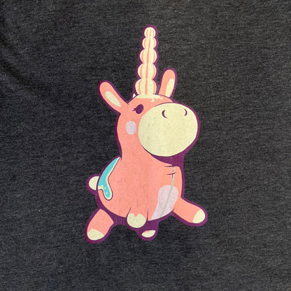 Team Fortress 2 “Balloonicorn & Sentry” 2010s Tee is a dark grey cotton-polyester blend T-shirt with a printed Valve neck tag. The front features a pink Balloonicorn graphic, while the back displays a red Engineer Sentry graphic. This officially licensed Team Fortress 2 T-shirt is a rare release.
