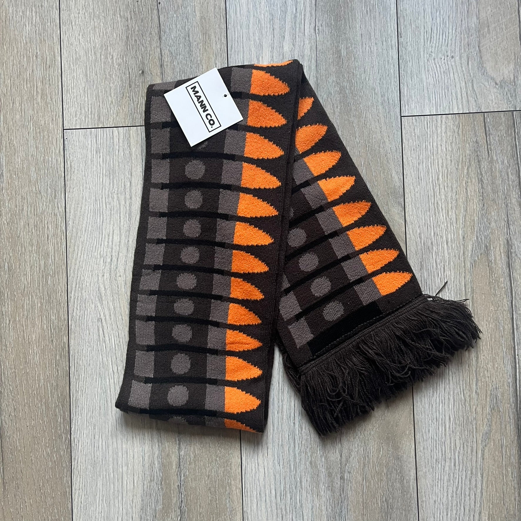 Officially licensed Team Fortress 2 merchandise released in 2014 by The Coop. This scarf is made from soft knit material and features a trompe-l’œil bullet bandolier graphic designed to replicate the ammunition belt worn by the Heavy character. Long and warm in construction, it displays repeated cartridge details along the length of the scarf.