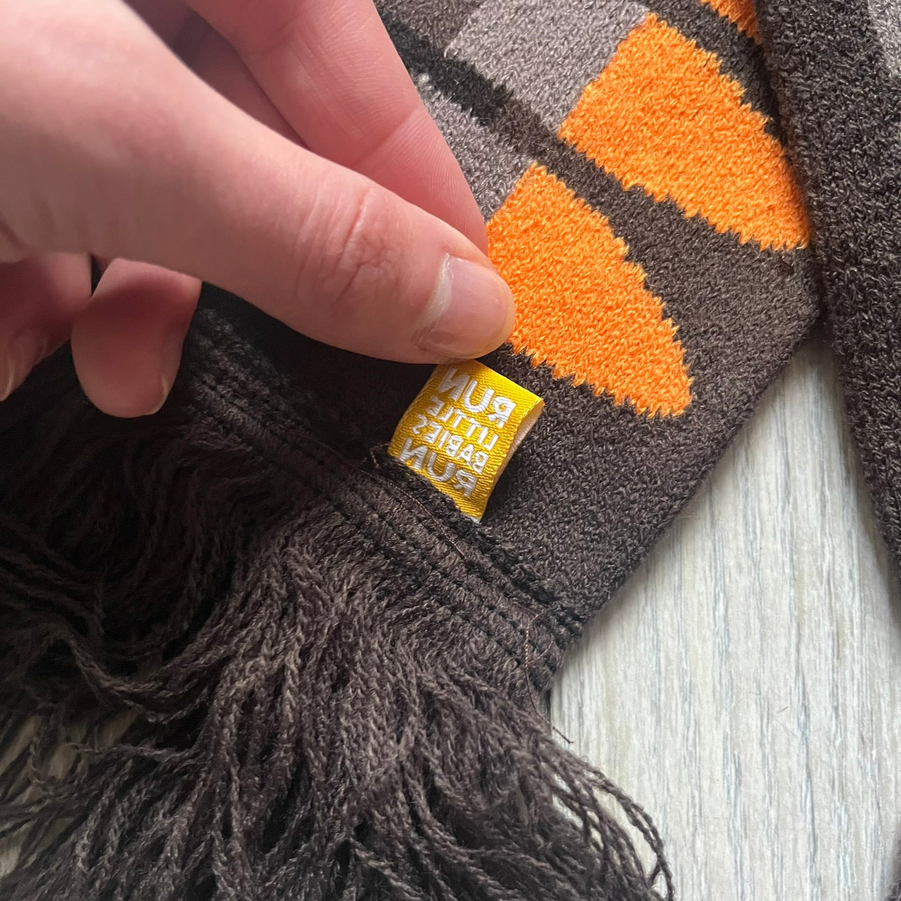Officially licensed Team Fortress 2 merchandise released in 2014 by The Coop. This scarf is made from soft knit material and features a trompe-l’œil bullet bandolier graphic designed to replicate the ammunition belt worn by the Heavy character. Long and warm in construction, it displays repeated cartridge details along the length of the scarf.