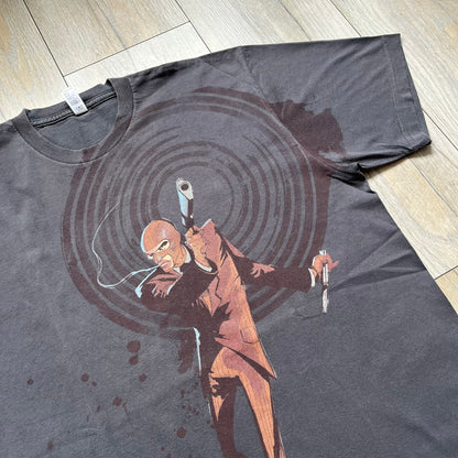 The Team Fortress 2 Red Spy 2010's Gray Tee is an official Valve shirt from the Sniper vs. Spy update, produced during Valve’s Amercian Apparel merch era. This charcoal gray tee features a red Spy character holding a butterfly knife and gun, set against a dark red target graphic with dripping effects. A super rare collectible, it represents one of the original Valve Store releases from over a decade ago.