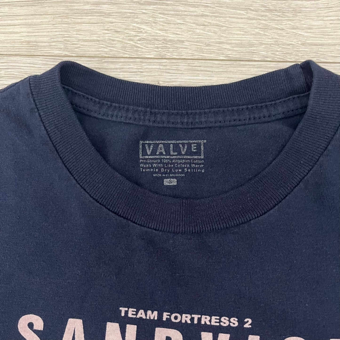 The Team Fortress 2 Sandvich 2010 Tee is an official Valve shirt released in December 2010 and produced during Valve’s in-house merch era. This Navy tee features a Sandvich Edible Device (Heavy secondary weapon) on the front, Sandvich blueprint graphic on the back and 'New Meat!' on the sleeve. A super rare collectible, it represents one of the original Valve Store releases from over a decade ago.