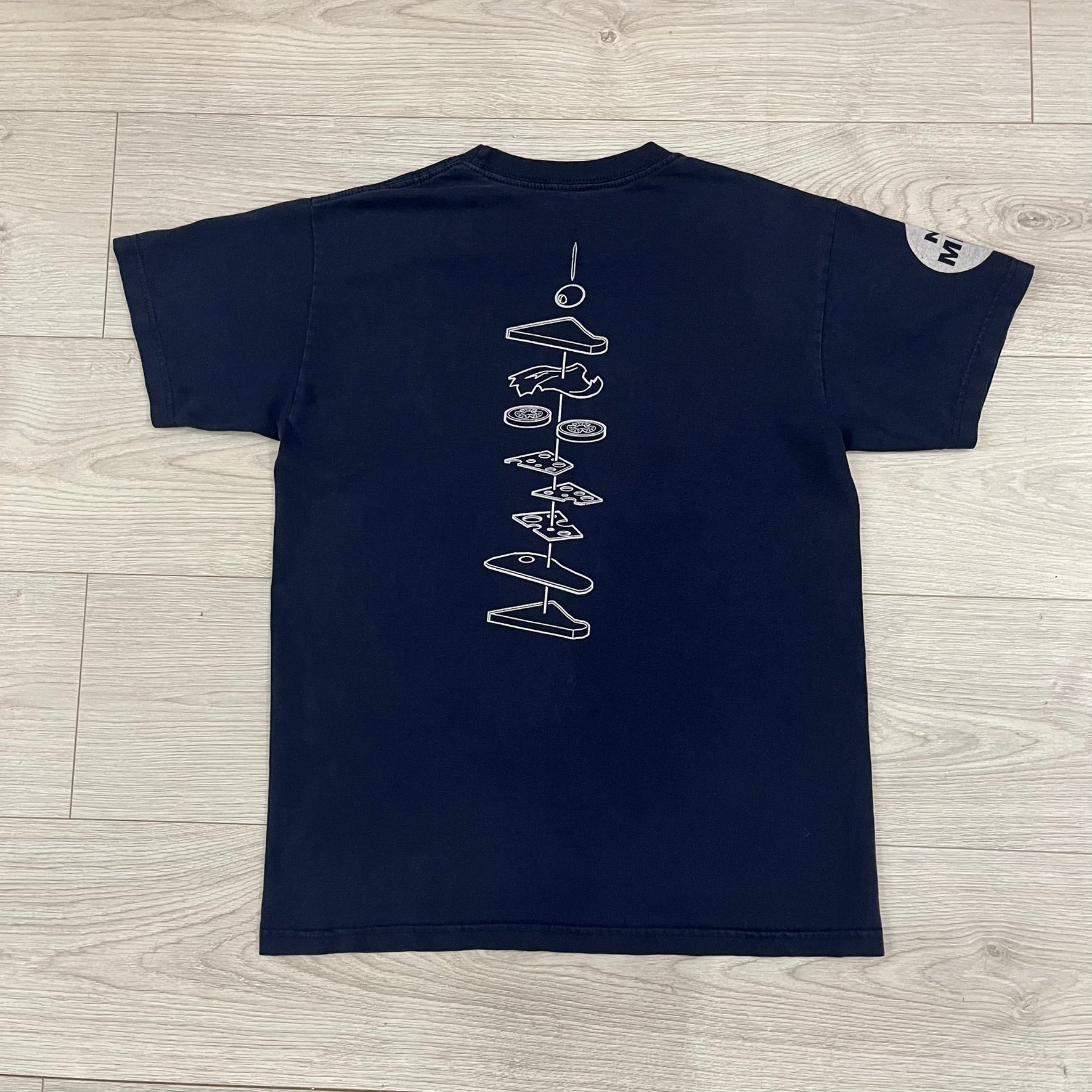The Team Fortress 2 Sandvich 2010 Tee is an official Valve shirt released in December 2010 and produced during Valve’s in-house merch era. This Navy tee features a Sandvich Edible Device (Heavy secondary weapon) on the front, Sandvich blueprint graphic on the back and 'New Meat!' on the sleeve. A super rare collectible, it represents one of the original Valve Store releases from over a decade ago.