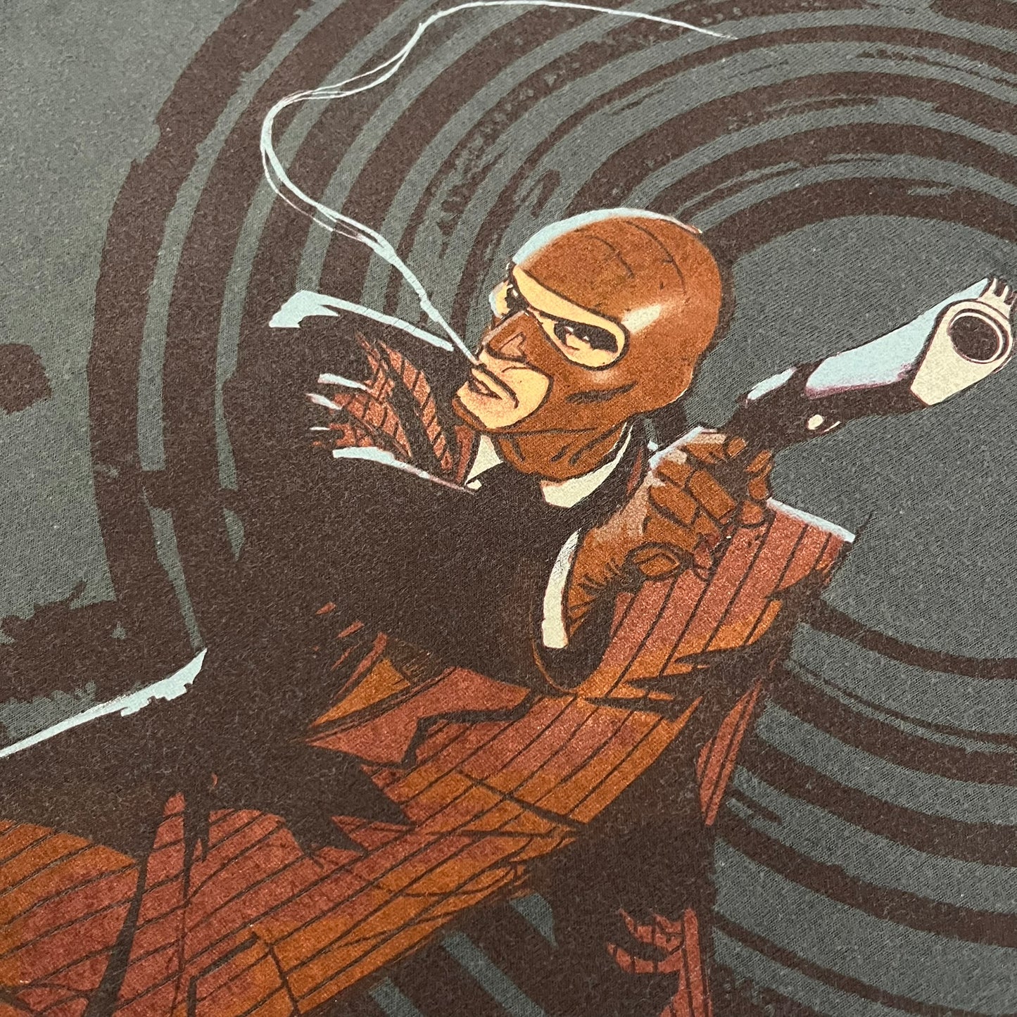 The Team Fortress 2 Spy 2009 Tee is an official Valve shirt from the Sniper vs. Spy update, produced during Valve’s in-house merch era before they switched to a different shirt company. This charcoal tee features a red Spy character holding a butterfly knife and gun, set against a dark red target graphic with dripping effects. A super rare collectible, it represents one of the original Valve Store releases from over a decade ago.