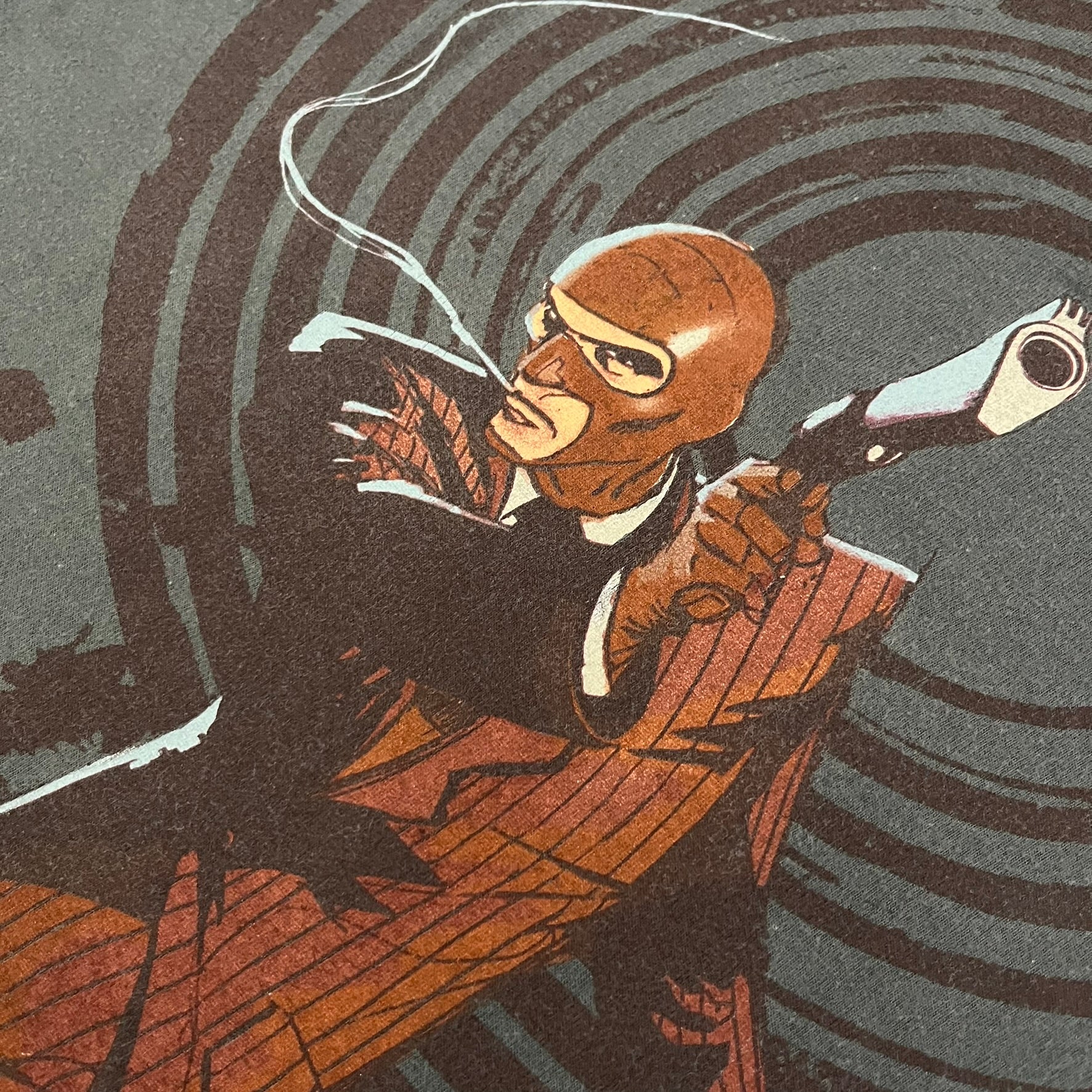 The Team Fortress 2 Spy 2009 Tee is an official Valve shirt from the Sniper vs. Spy update, produced during Valve’s in-house merch era before they switched to a different shirt company. This charcoal tee features a red Spy character holding a butterfly knife and gun, set against a dark red target graphic with dripping effects. A super rare collectible, it represents one of the original Valve Store releases from over a decade ago.