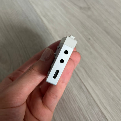 Teenage Engineering YZY 2019 OG Stem Player, an unreleased collaboration between Kanye West and Teenage Engineering. This rare device allows you to isolate stems like vocals, drums, and bass while adding effects such as filters, echo, and distortion. Featuring a sleek, minimalist metal design and ergonomic build, it was first seen during Kanye’s 2019 Sunday Service era and came paired with exclusive extended versions of “Jesus Is King.” Fully compatible with headphones and speakers, it remains a sought-afte