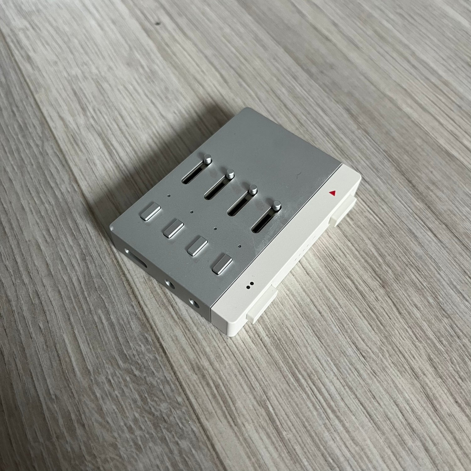 Teenage Engineering YZY 2019 OG Stem Player, an unreleased collaboration between Kanye West and Teenage Engineering. This rare device allows you to isolate stems like vocals, drums, and bass while adding effects such as filters, echo, and distortion. Featuring a sleek, minimalist metal design and ergonomic build, it was first seen during Kanye’s 2019 Sunday Service era and came paired with exclusive extended versions of “Jesus Is King.” Fully compatible with headphones and speakers, it remains a sought-afte