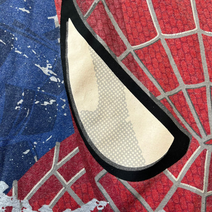 Gray 2014 Marvel tee featuring The Amazing Spider-Man 2 design with a “ripped page” effect showcasing Spider-Man’s face in the center. Text logo sits beneath the graphic for a bold cinematic touch. A collectible piece from the official movie merchandise line.