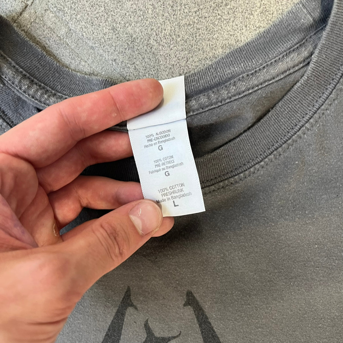 The Elder Scrolls V: Skyrim Premium Edition Tee comes from the 2012 Premium release of the game. Dark gray design with the Skyrim dragon logo printed on the front chest. The upper back has the full “The Elder Scrolls V: Skyrim” text. On the left sleeve there is a text in Dragon language. Made on a Gildan blank.