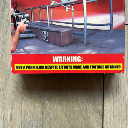 The People Vs. Porn Star is a 22-minute VHS video released in 2000 by Porn Star Skateboards in the United States. The tape features a mix of skate footage, live concert clips with featured artists, staged vignettes, and an on-camera segment with Sean “Vader” Murphy discussing the media attention surrounding the brand at the time. Original cover art includes the subtitle text “Not a Porn flick despite effort made and footage obtained” printed along the bottom.