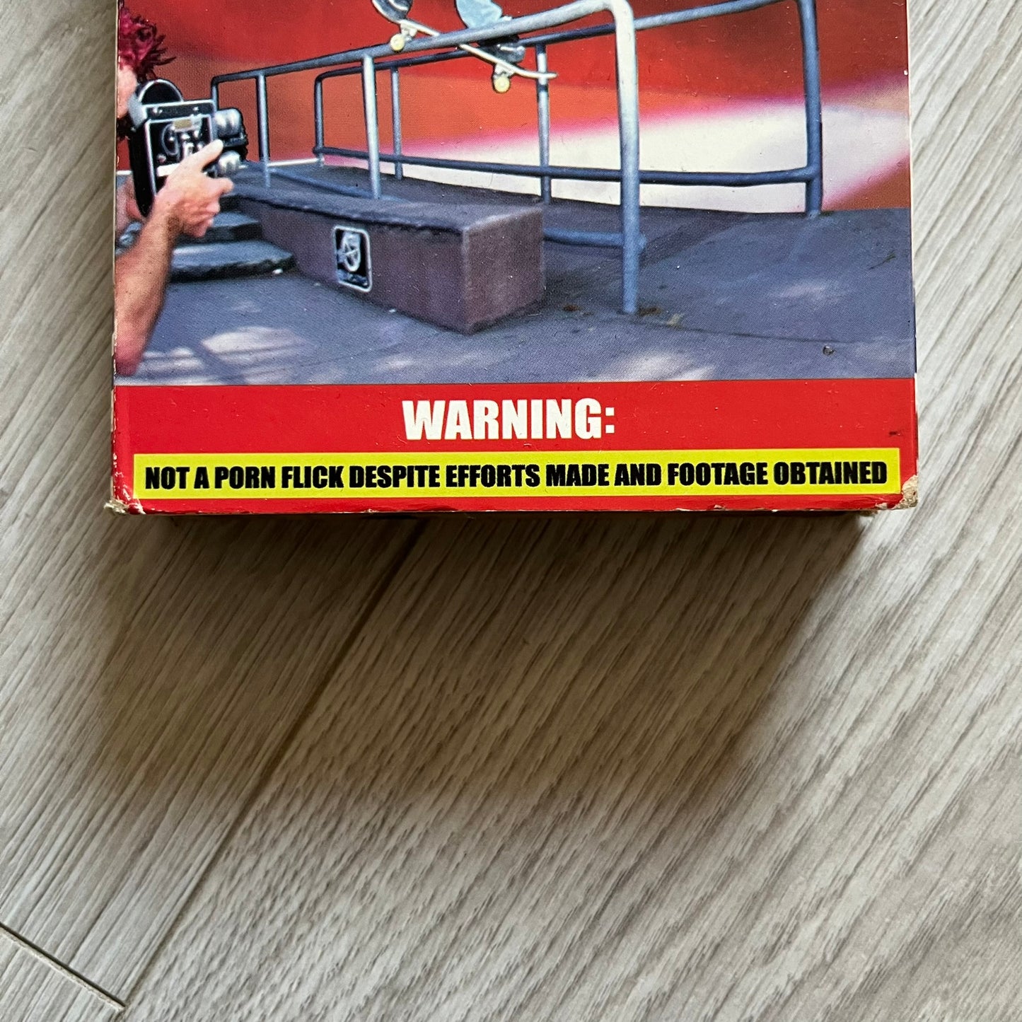 The People Vs. Porn Star is a 22-minute VHS video released in 2000 by Porn Star Skateboards in the United States. The tape features a mix of skate footage, live concert clips with featured artists, staged vignettes, and an on-camera segment with Sean “Vader” Murphy discussing the media attention surrounding the brand at the time. Original cover art includes the subtitle text “Not a Porn flick despite effort made and footage obtained” printed along the bottom.