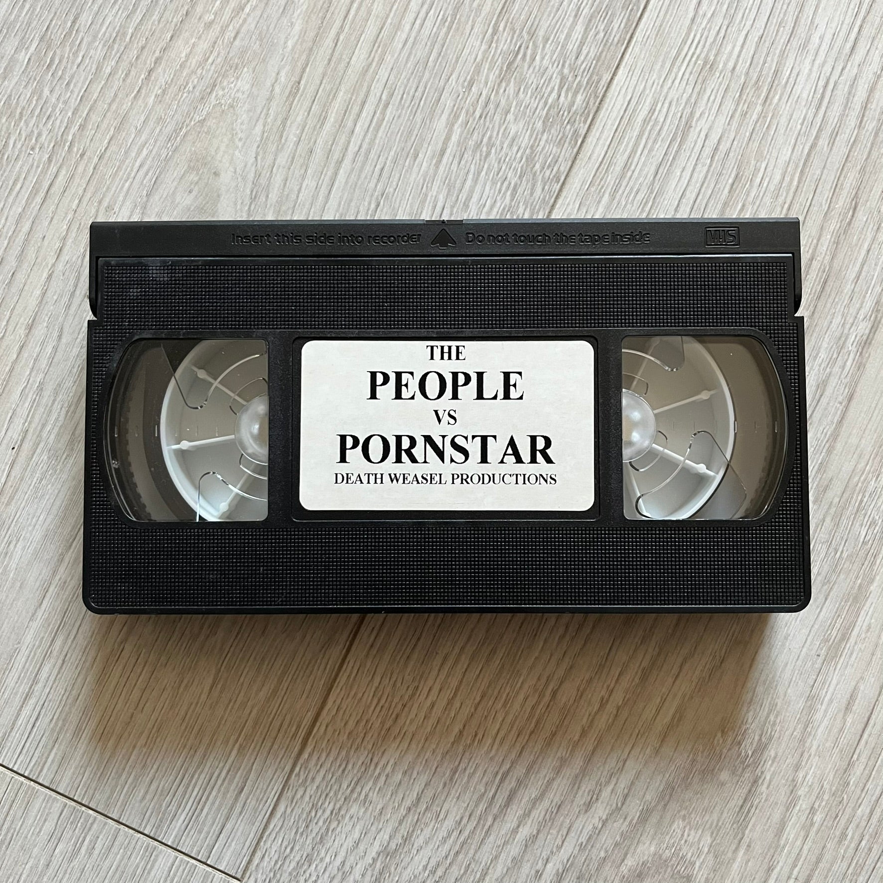 The People Vs. Porn Star is a 22-minute VHS video released in 2000 by Porn Star Skateboards in the United States. The tape features a mix of skate footage, live concert clips with featured artists, staged vignettes, and an on-camera segment with Sean “Vader” Murphy discussing the media attention surrounding the brand at the time. Original cover art includes the subtitle text “Not a Porn flick despite effort made and footage obtained” printed along the bottom.