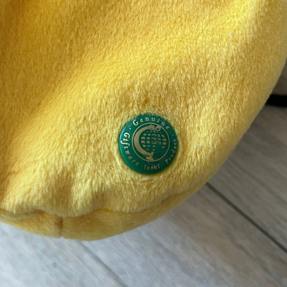 The Simpsons 1990s Homer Simpson Head Shoulder bag is shaped like a 3D Homer Simpson head. The design is yellow with soft sculpted facial features including eyes and nose, a molded beige mouth, and protruding ears. The hair detail wraps around the back, with the top strands functioning as a hanger. It includes a black string and a single main compartment.