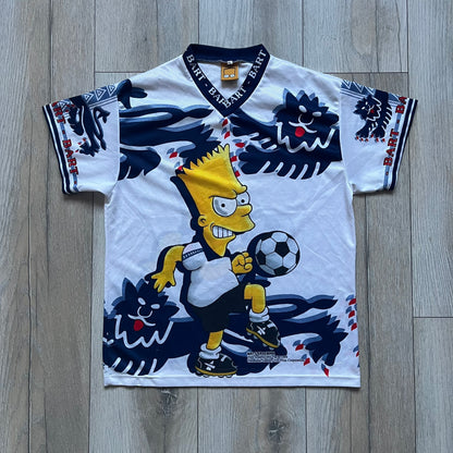 Officially licensed 1999 The Simpsons World Cup T-shirt for England. Lightweight white polyester tee featuring an all-over graphic design. The front shows Bart Simpson kicking a football, dressed in a white tee, with multiple England three-lions emblems layered across the background from top to bottom. Red “Bart” text details appear on the sleeve hems, with Matt Groening / The Simpsons ©1999 licensing printed beneath the main graphic.&nbsp;The back mirrors the artwork in a flipped layout, showing Bart from 