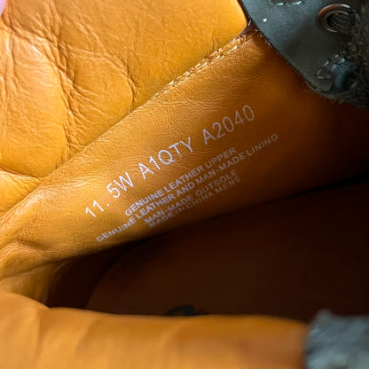 Timberland 6-Inch x Zoolander Olive Boots, model A1QTY / A2040. These collaboration boots feature an olive/army green upper with an orange metal Timberland logo on the side and an orange padded collar with large olive Timberland text. The laces are olive with small orange speckled details, matched by orange lace eyelets. This Zoolander collaboration was not sold in the United States and is considered extremely difficult to find.