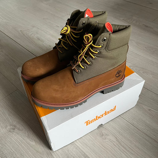 Timberland Heritage 6-Inch Waterproof Boots in brown and khaki. Built for warmth, durability, and everyday wear with waterproof premium leather, PrimaLoft® insulation, and TimberDry™ waterproof technology. Includes a cushioned anti-fatigue footbed, padded collar, and steel shank for superior comfort and support. A timeless essential made for all conditions.