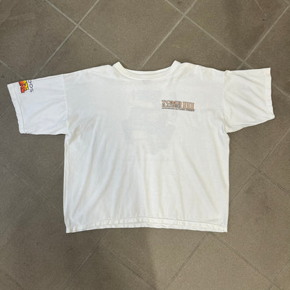 Tomb Raider III 1998 “Lara’s Back” White Tee is a boxy white T-shirt made on a Sierra Teez blank, with a stone-styled Tomb Raider III: Adventures of Lara Croft logo on the front. The back has a low-poly graphic of Lara Croft ass with “Lara’s Back...” text underneath, and the sleeve carries Eidos and Core logos.