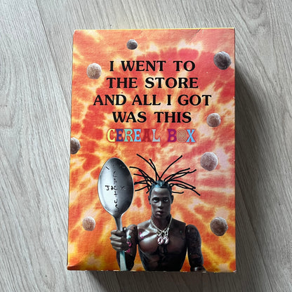 Travis Scott x Reese’s Puffs Cereal released in 2019 as a collaboration between Travis Scott and General Mills. The limited-edition box features the rapper on the front with his arms spread behind a bowl of Reese’s Puffs, and an action figure graphic on the back with the Cactus Jack logo. Originally sold at Target and Walmart, this collector’s item is not fit for human consumption.