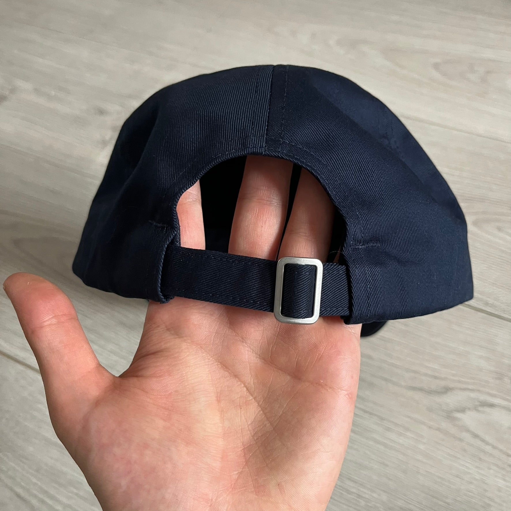 Uniqlo x CPFM Spongebob Navy Cap from FW24, released on 12/12/2024. This navy UV protection cap features a playful SpongeBob SquarePants design, part of the Uniqlo x Cactus Plant Flea Market collaboration. Lightweight and functional, it combines casual style with sun protection, making it a fun and practical accessory.